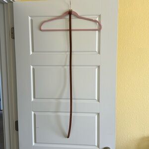 Brownish tan belt with gold buckle